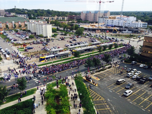 Vikings fans board the METRO Green Line at Stadium Village Station.