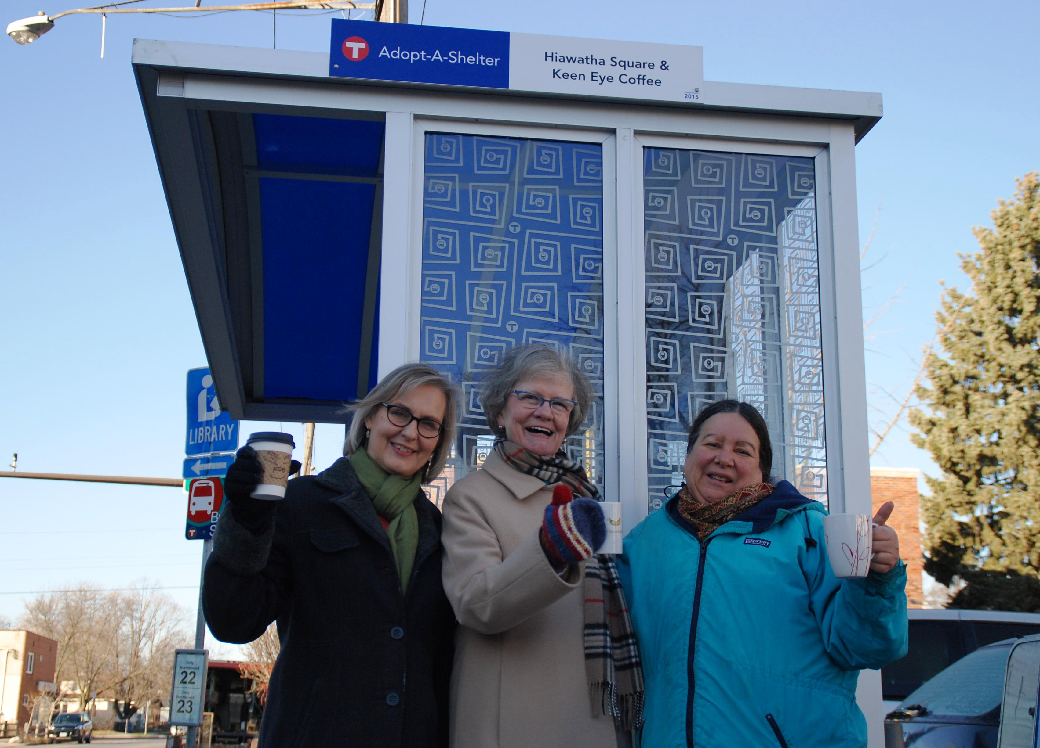 Ann Erickson, owner of Keen Eye Coffee, Doris Overby, a neighborhood block leader, and Francy Scurato, also a neighborhood block leader, with the shelter they adopted at the corner of East 38th Street and South 28th Avenue. 