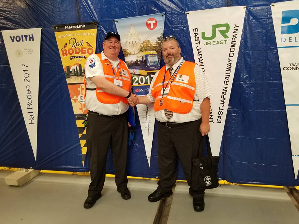 Train operators Peter Mooers, left, and Bill Morris, right, took fourth place in the American Public Transit Association’s International Rail Rodeo held earlier this month in Baltimore, Md. 