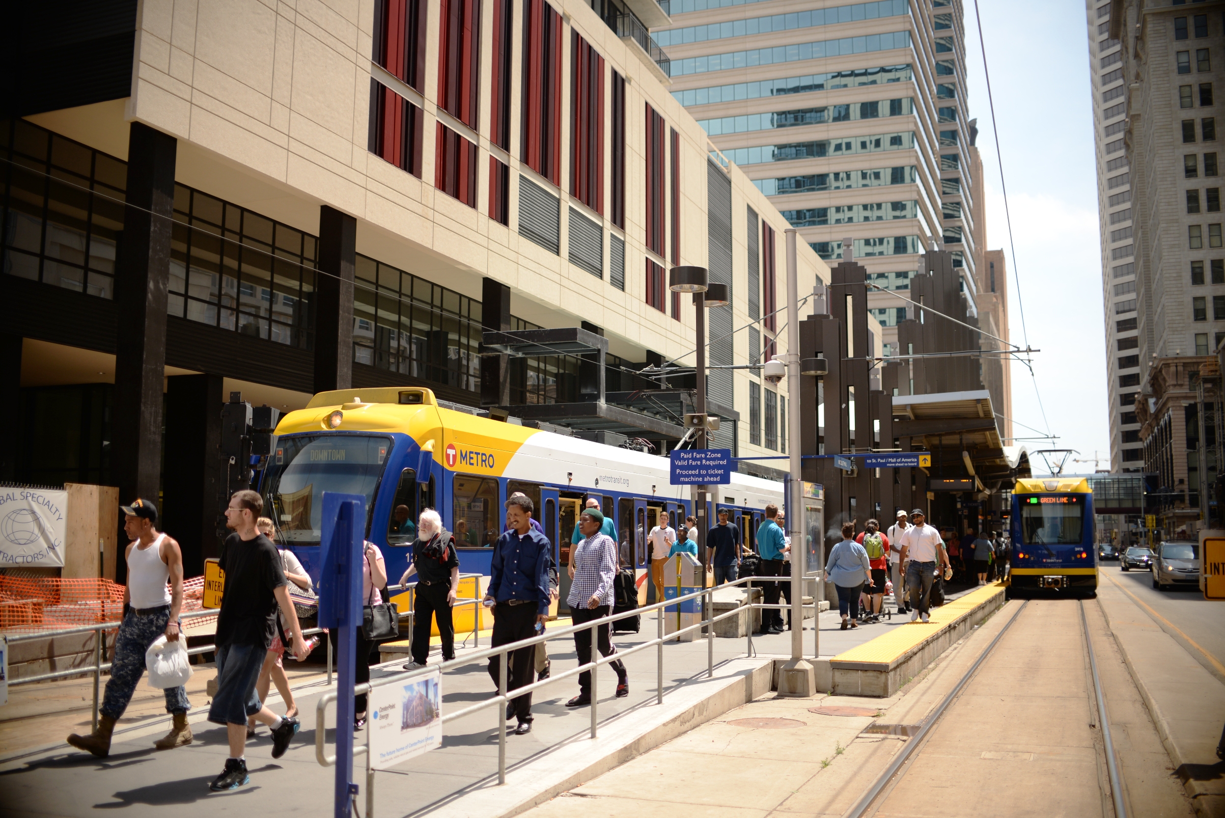 Customers exit a light-rail train at Nicollet Mall Station in downtown Minneapolis.
