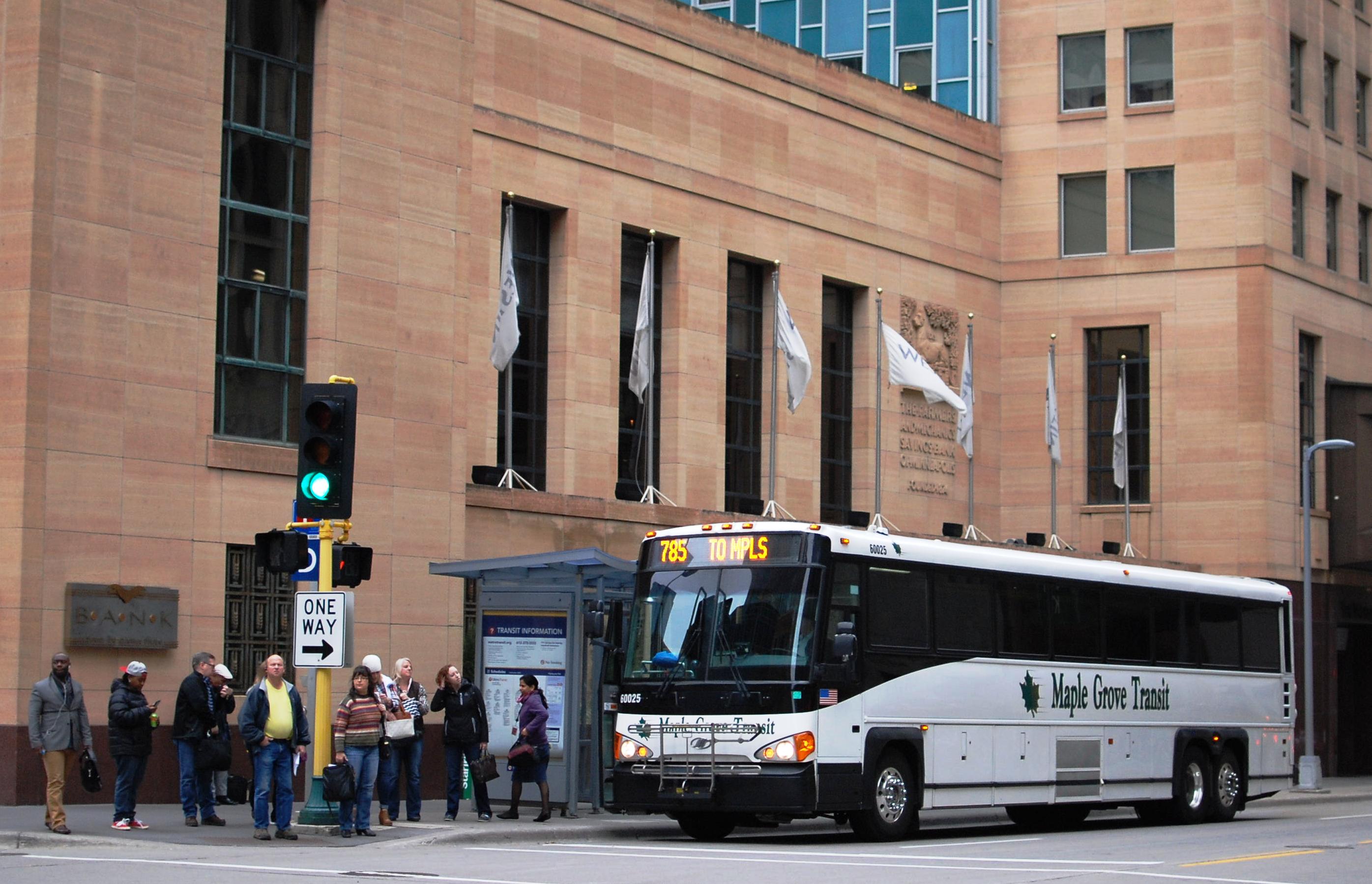 Customers exit a Maple Grove Transit bus in downtown Minneapolis.