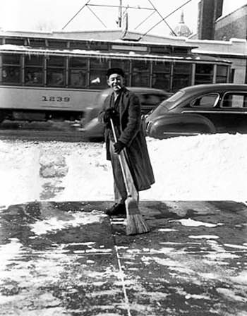 photo of man clearing snow in 1951 in St. Paul
