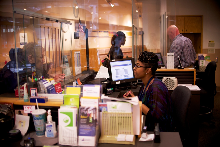 Lalita Williams (foreground) and Tim Johnson assist customers at the Metro Transit store on Marquette Avenue in Minneapolis.
