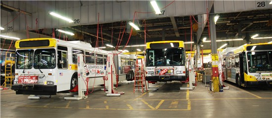 Buses on a hydraulic lift at Metro Transit's Overhaul Base