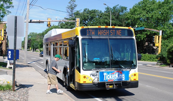 A passenger boards a Route 17 bus in St. Louis Park. 