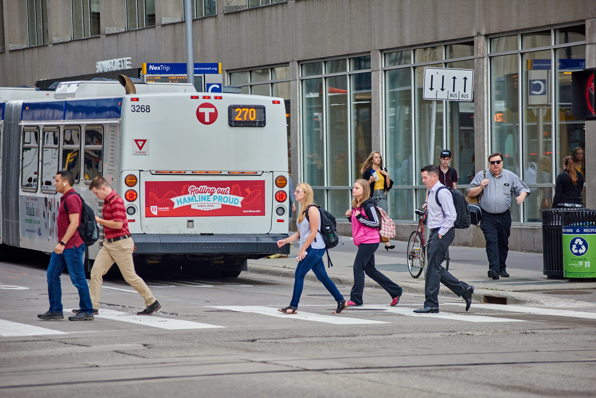 Image of bus with advertisement on taillight.
