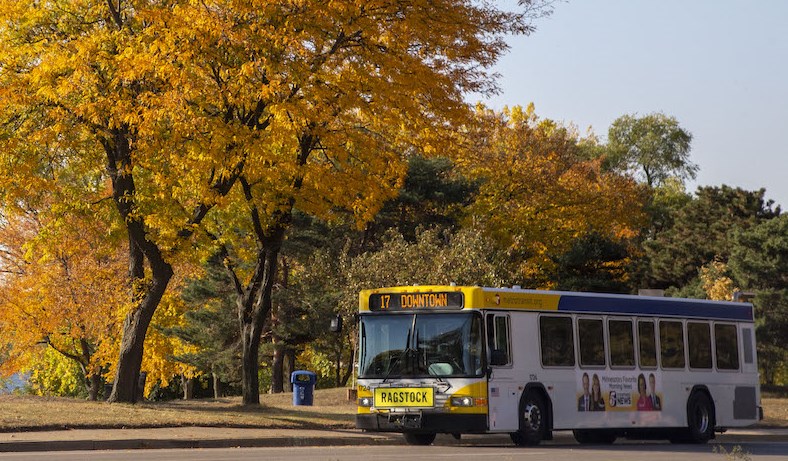 A route 17 bus in foreground with fall colors as a backdrop.