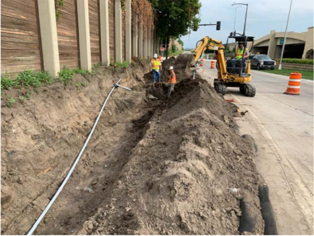 Construction photo - example of placing utility tubes on the Orange Line project