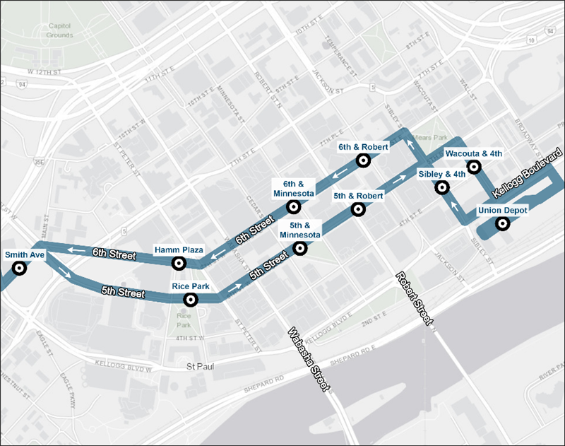 Overview map of shared Gold Line stations in downtown Saint Paul. Prior to turning onto 5th Street, eastbound B Line buses will use a Gold Line station on Smith Avenue south of 5th Street. On 5th Street, eastbound B Line buses will use Gold Line stations at Rice Park, Minnesota Street, and Robert Street before turning right onto Wacouta Street and stopping at a Gold Line station on 4th Street. From there, buses will turn left onto Kellogg Boulevard and right onto Broadway Street, where they will enter Union Depot Transit Center on the south side of Union Depot. Westbound B Line buses starting from Union Depot will turn left onto Kellogg Boulevard and then right onto Sibley Street and stopping at a Gold Line station on 4th Street. From there, westbound B Line buses will turn left onto 6th Street stopping at Gold Line stations at Robert Street, Minnesota Street, and Hamm Plaza before turning left and using the Gold Line station on Smith Avenue.