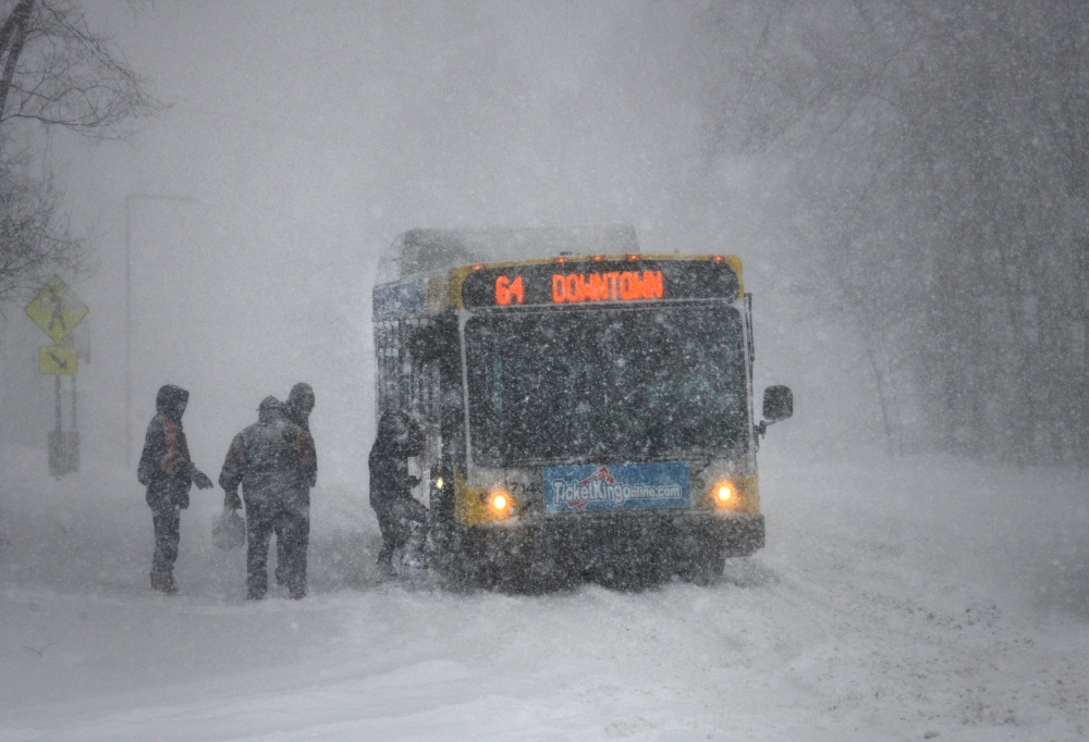 A Metro Transit operator picks up Route 64 customers in St. Paul during a blizzard on Saturday, April 14, 2018.