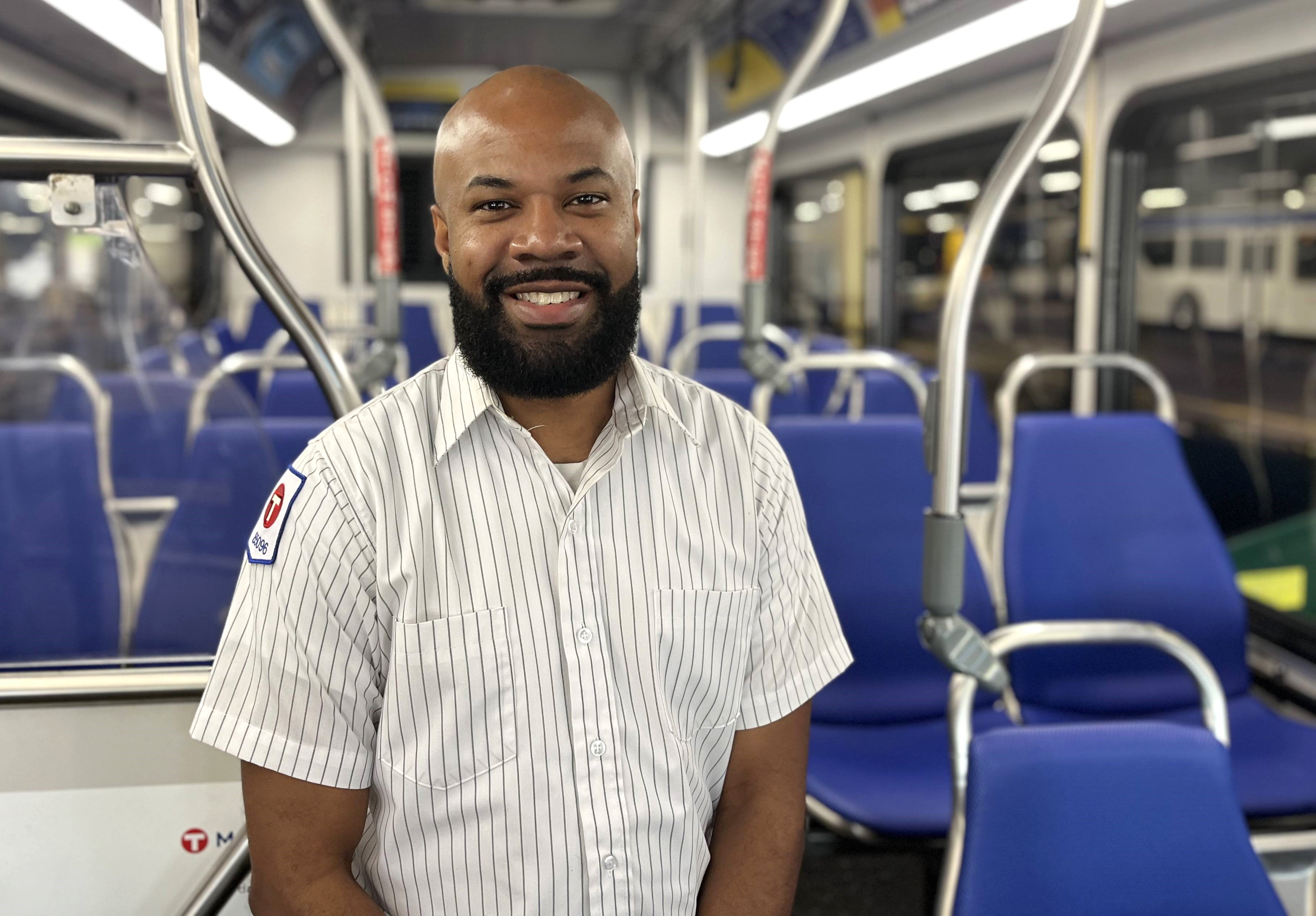 Operator Al Chang inside a Metro Transit bus. Operator Al Chang inside a Metro Transit bus.