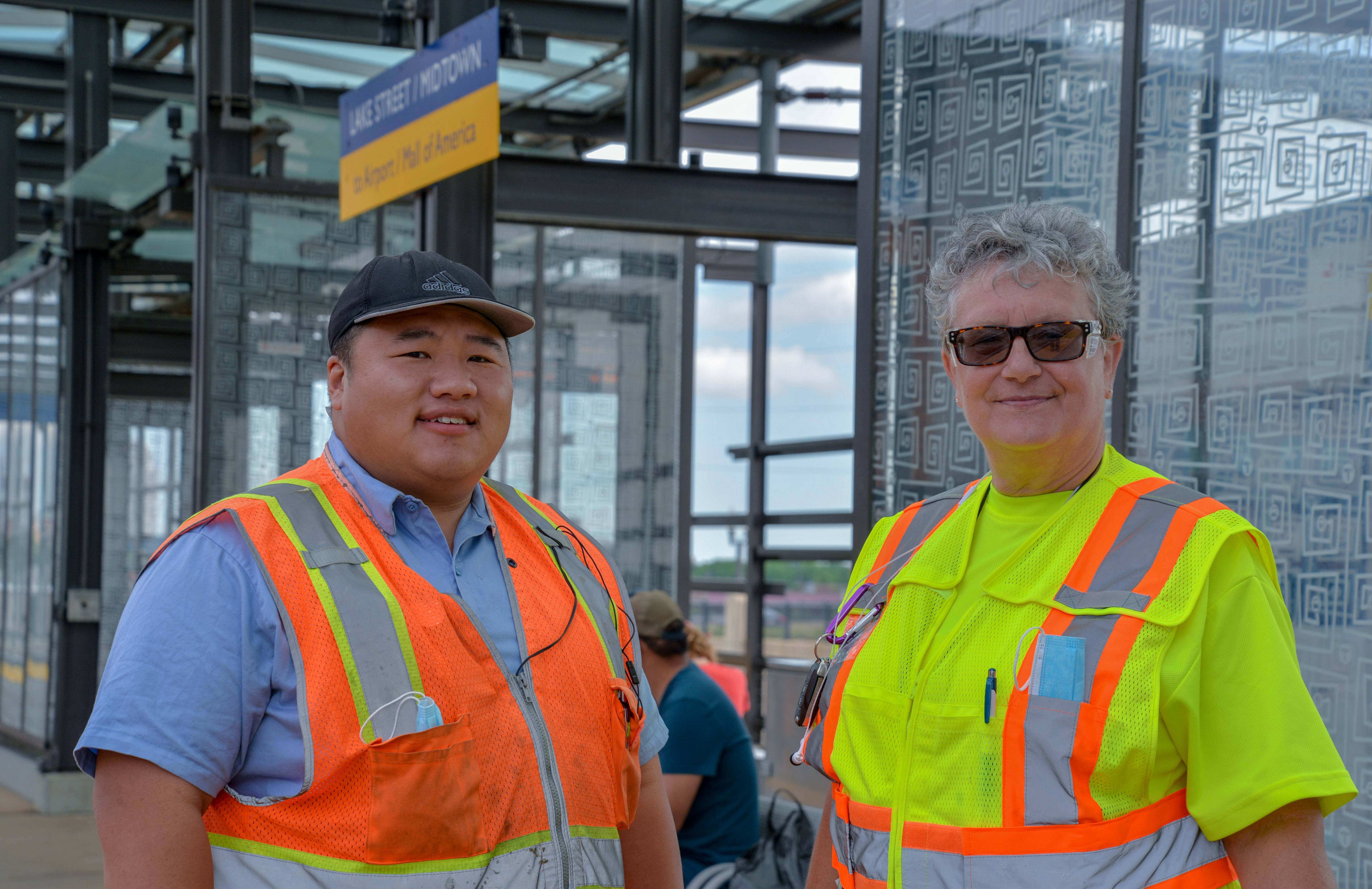 Public Facility Workers Chang Yang and Julie Mickus at the Lake Street Station. 