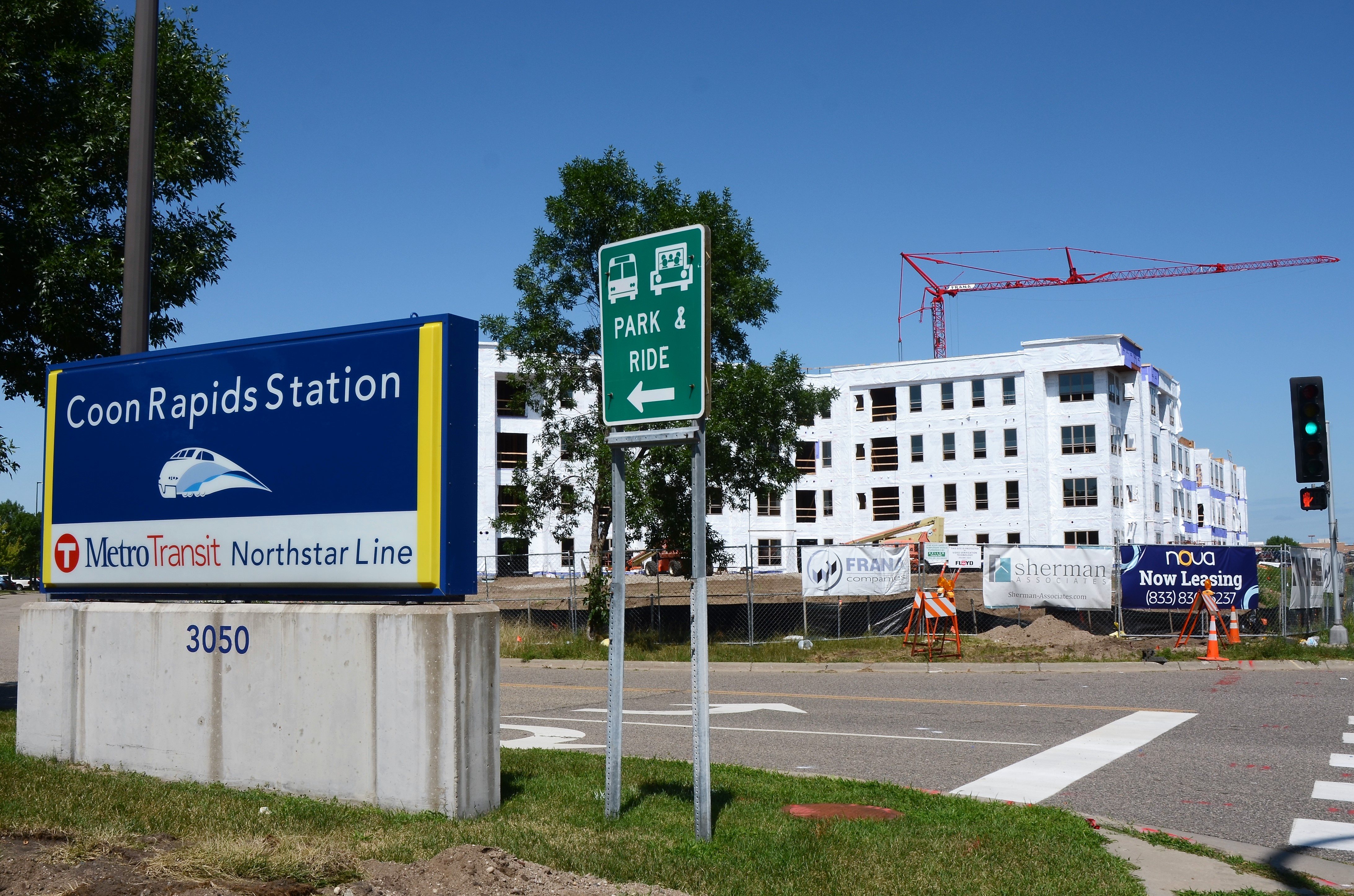 Construction continues near the Northstar Commuter Rail Line’s Coon Rapids/Riverdale Station, where Minneapolis-based Sherman Associates is building a 180 market-rate apartment project called Lyra, and a 71 affordable apartment project called Nova. 