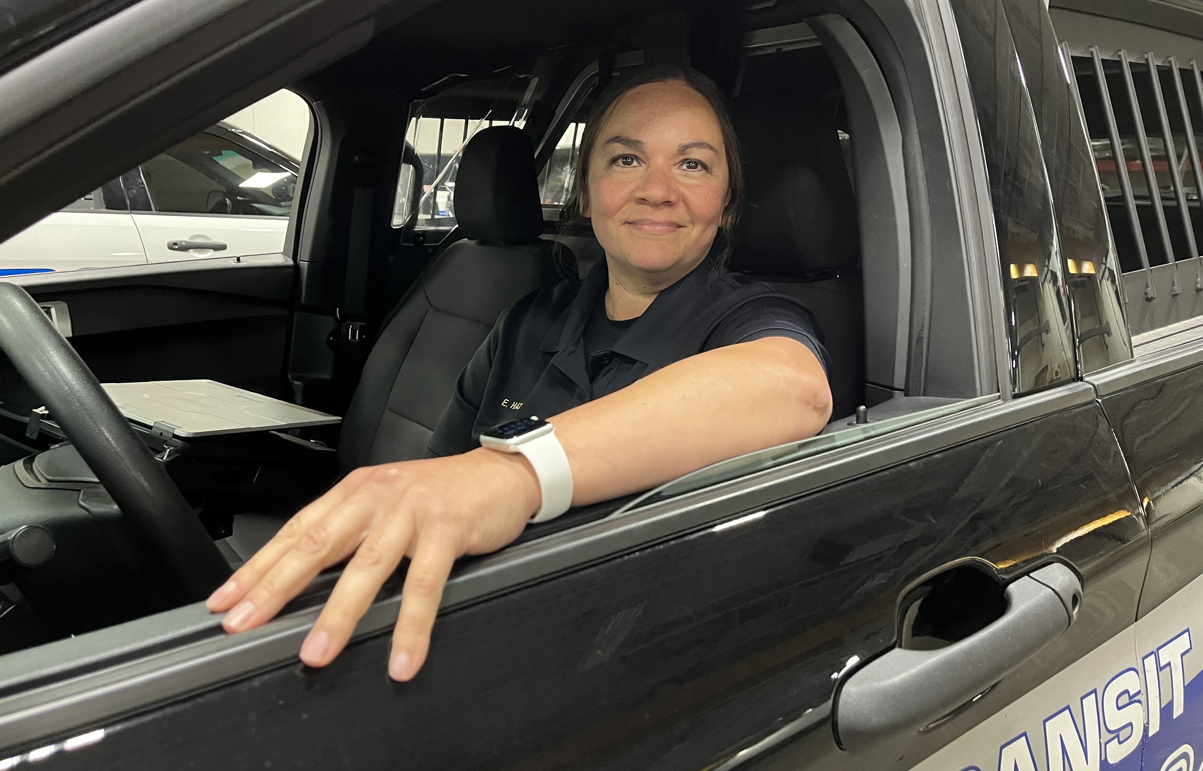 Police Officer Erika Hatle in a squad car.