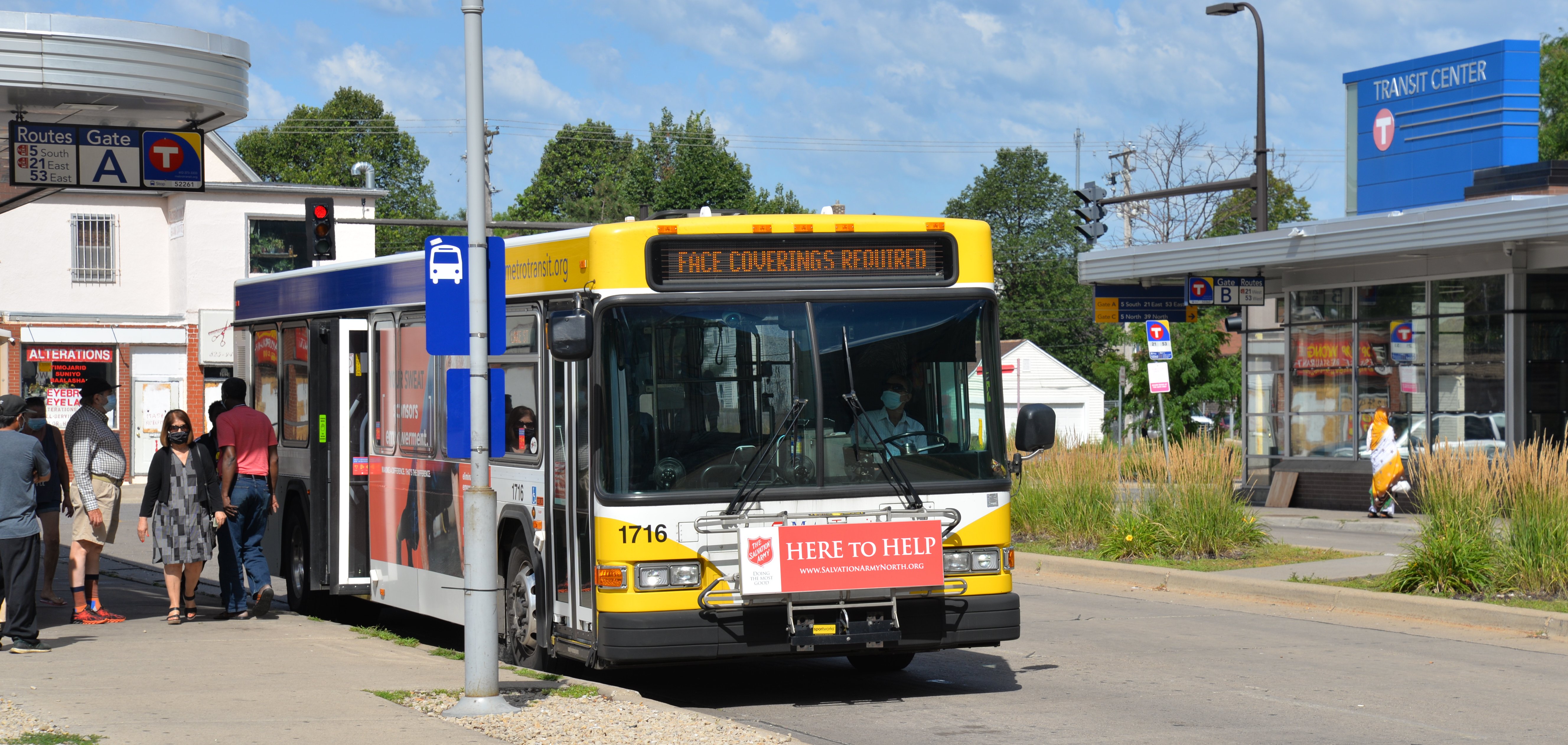 Customers exit a bus at the Chicago-Lake Transit Center in Minneapolis. 