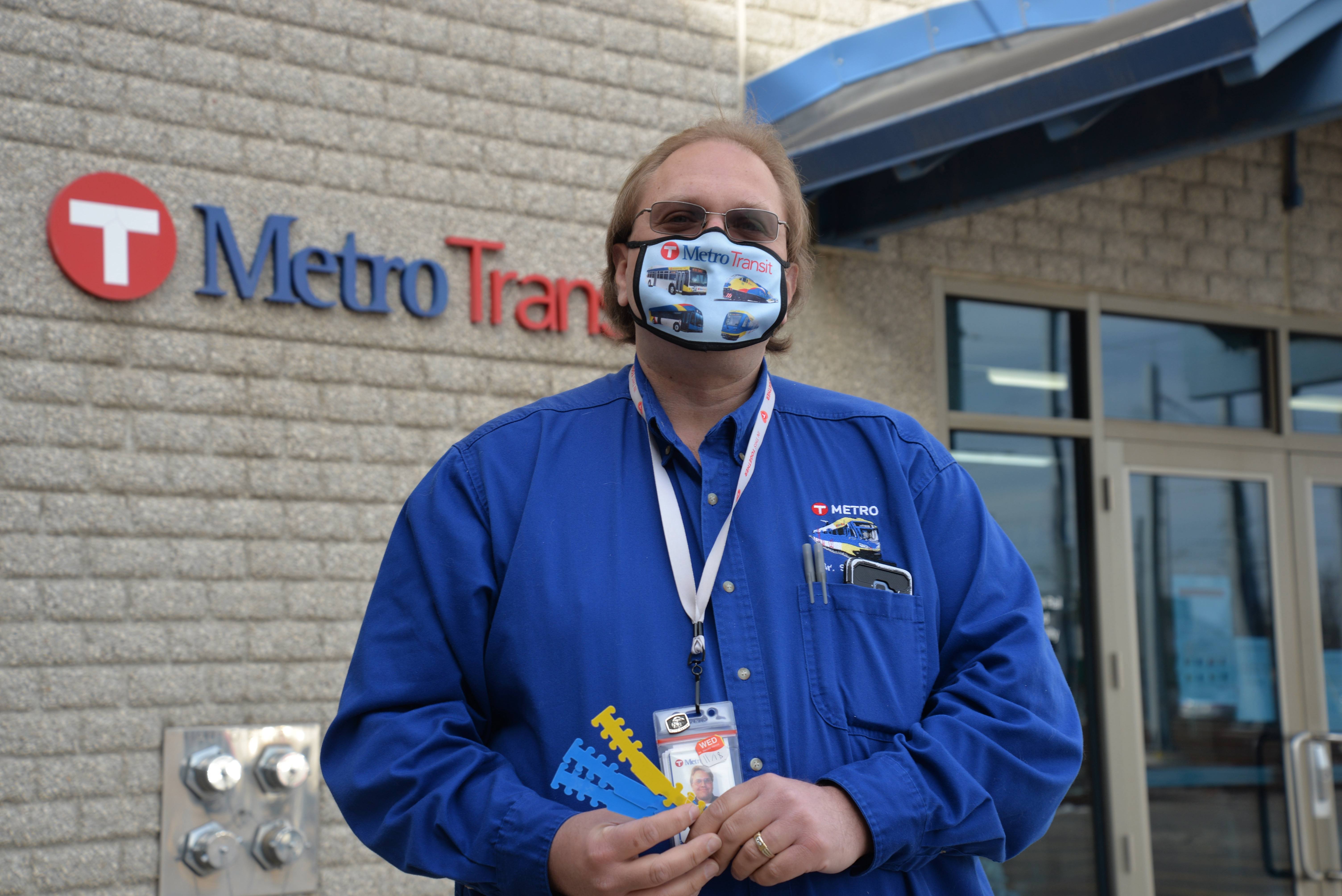 Senior Rail Supervisor Jonathon Hendrickson with ear savers he made using a laser cutter.