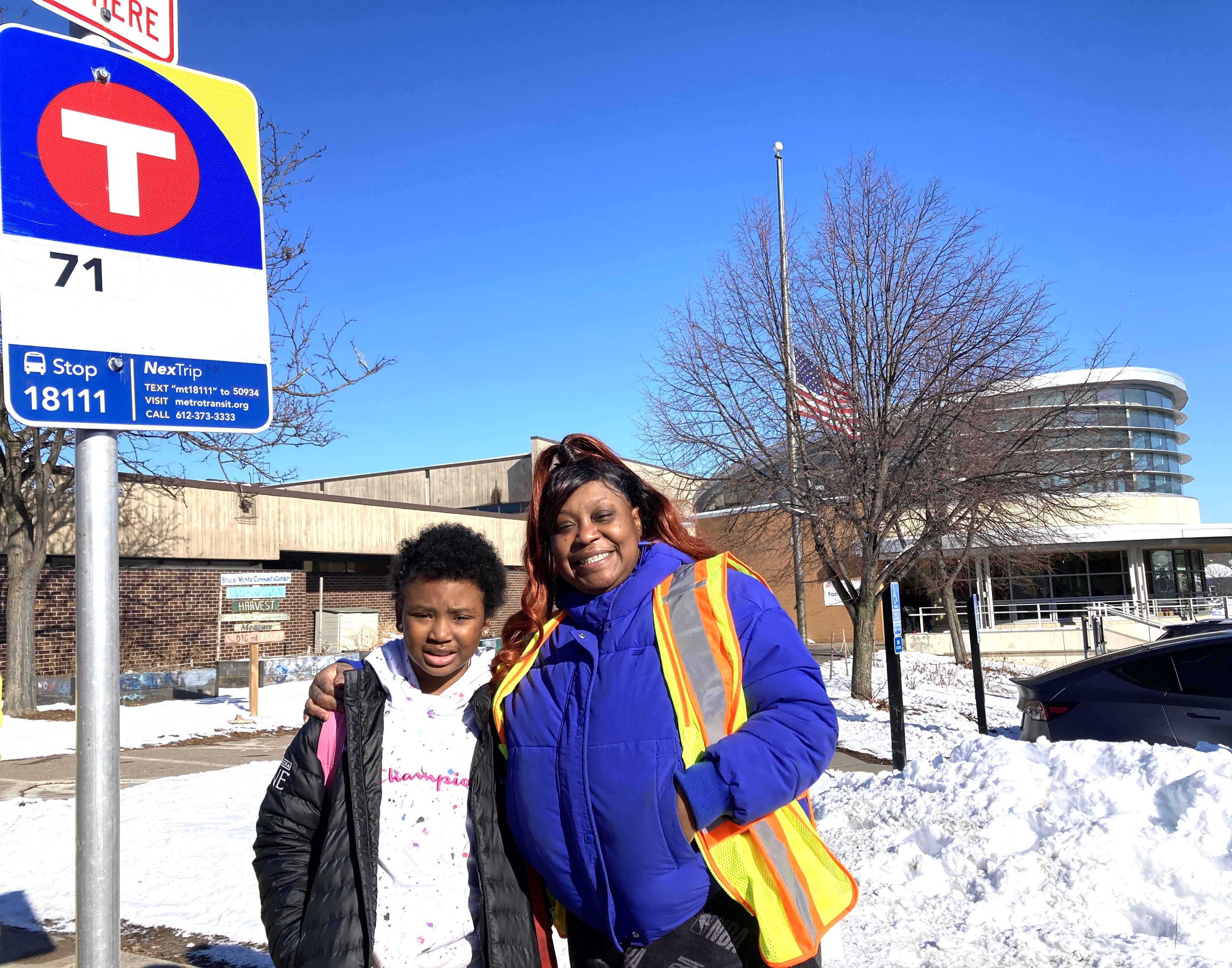 Keshawn and Josephine Williams at the bus stop they adopted near Bruce Vento Elementary School.