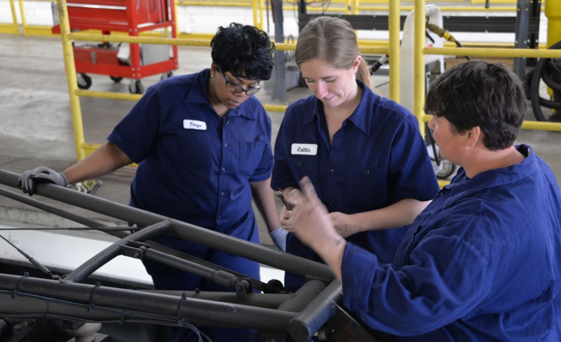 Participants in the Metro Transit Technician program work on a pantograph at the Hiawatha Operations & Maintenance Facility. Participants in the Metro Transit Technician program work on a pantograph at the Hiawatha Operations & Maintenance Facility.