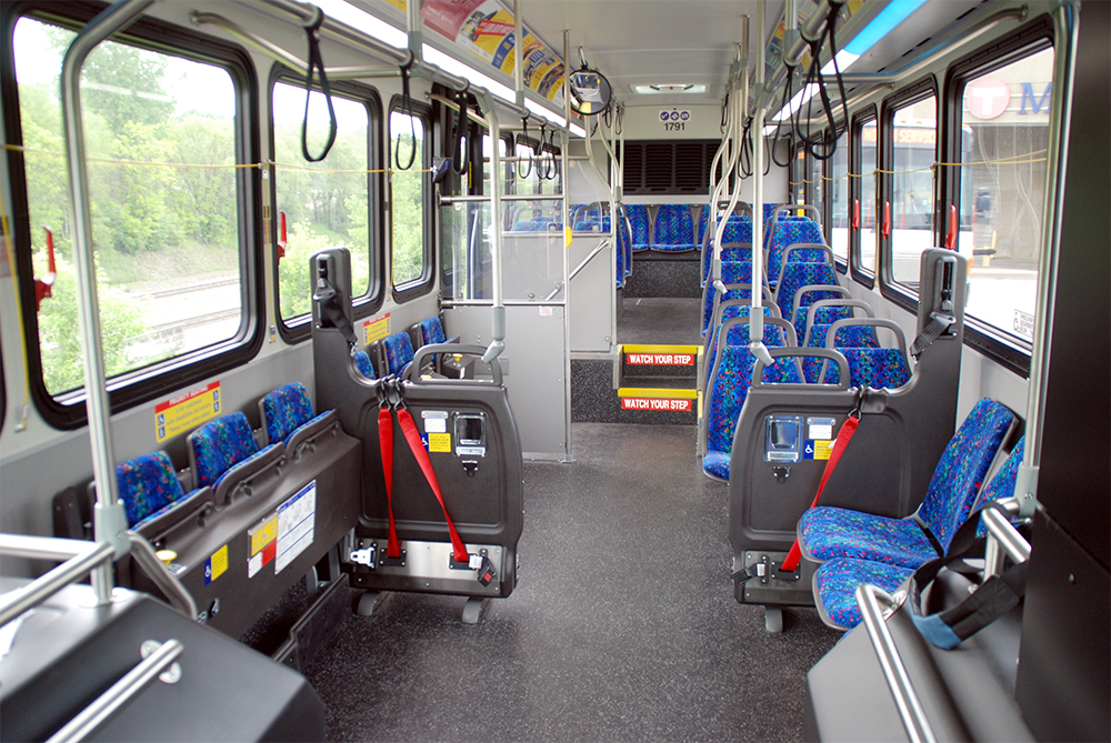 Metro Transit's newest buses replace three rows of front-facing seats on the passenger side with a single row of inward facing seats that customers can put in the up or down position.