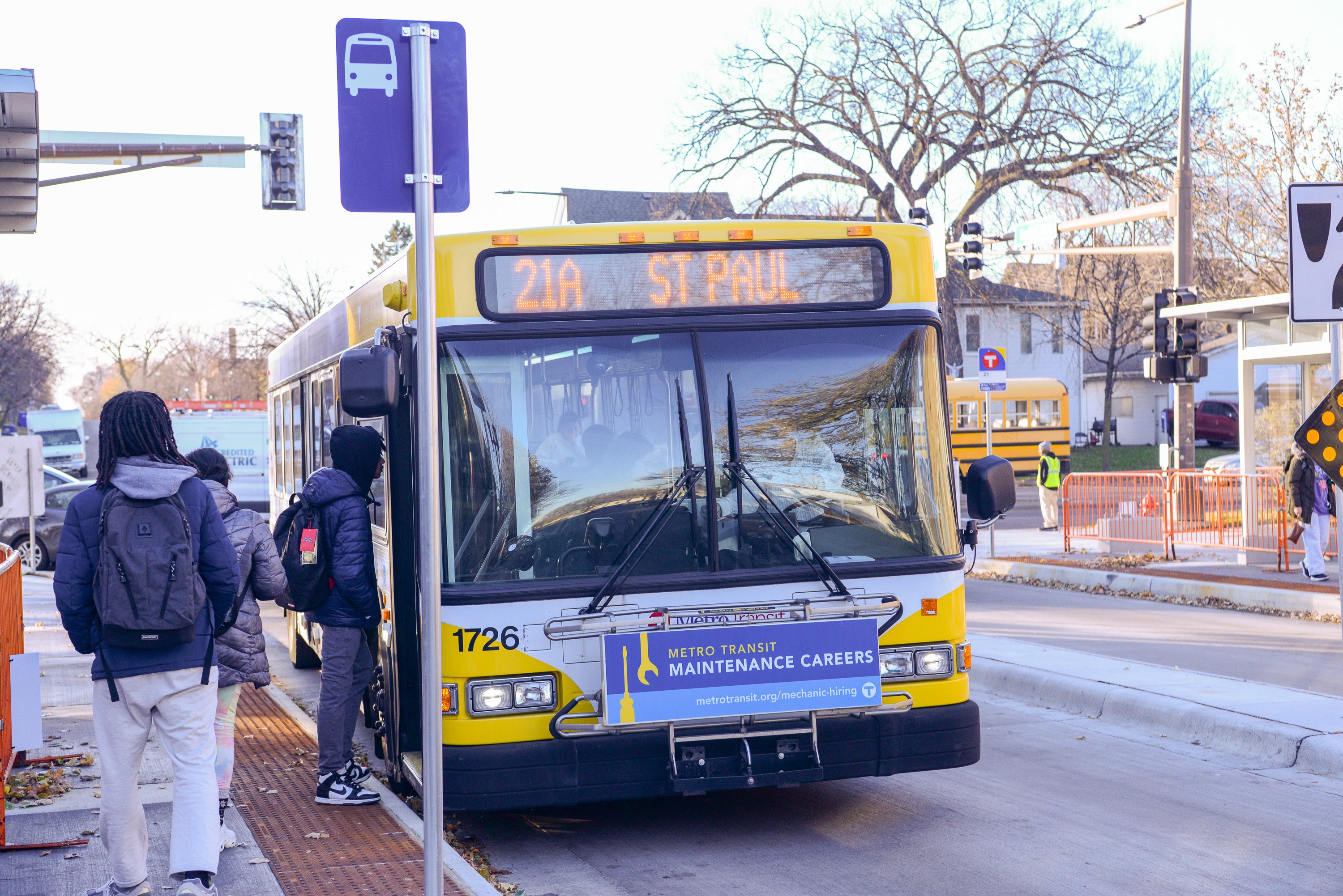 Customers board a Route 21 bus in Saint Paul.