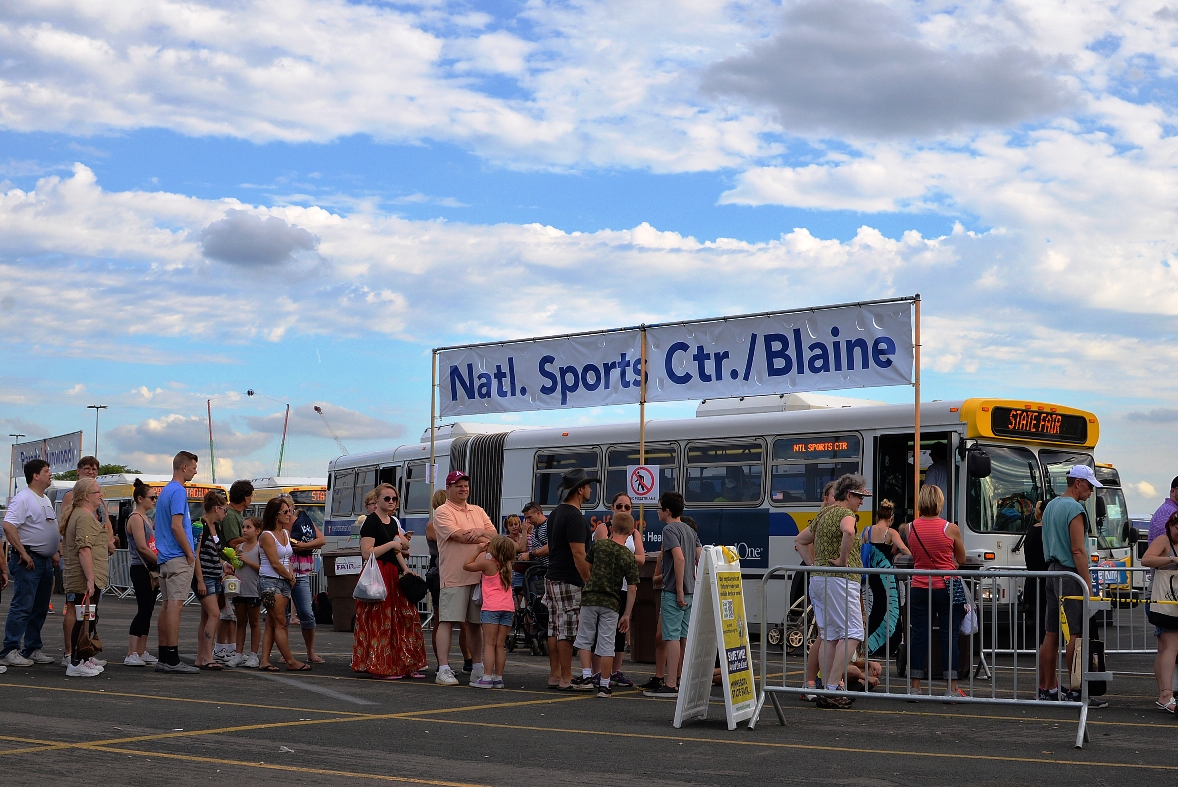 Fairgoers board a Metro Transit State Fair Express Bus at the 2015 State Fair.