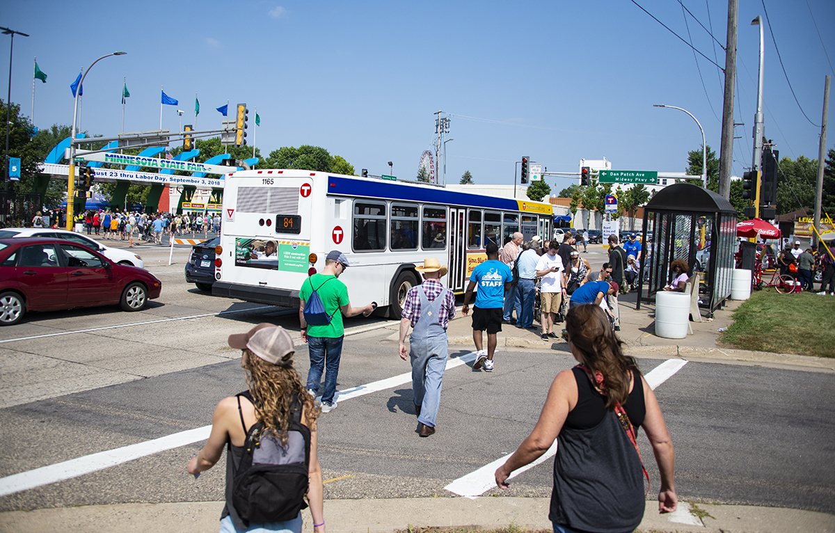 Minnesota State Fair visitors arrive at the fairgrounds on a Route 84 bus during the 2018 State Fair.