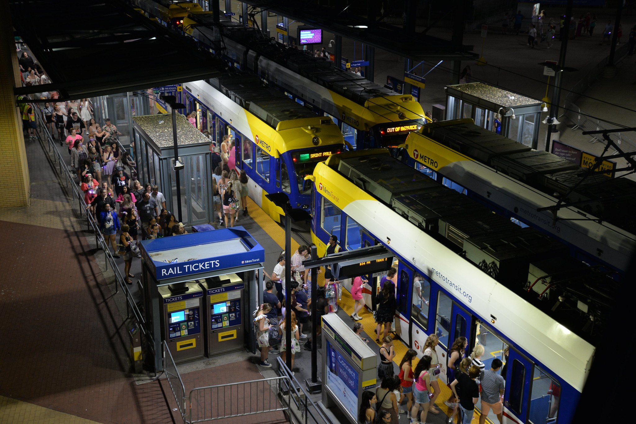 Fans line up to board a light rail vehicle after a Taylor Swift concert at U.S. Bank Stadium. 