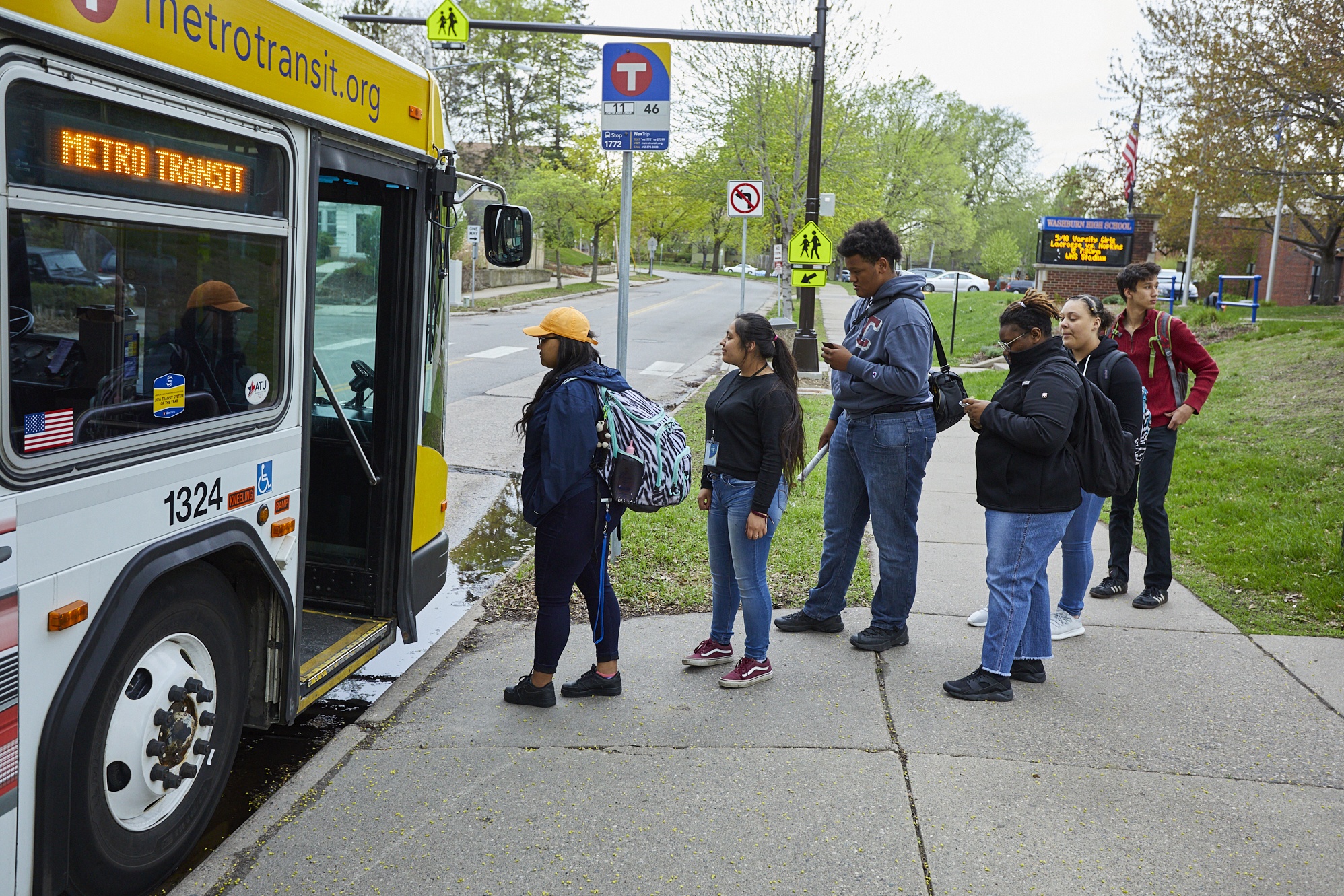 Students from Washburn High School board a Metro Transit bus. 