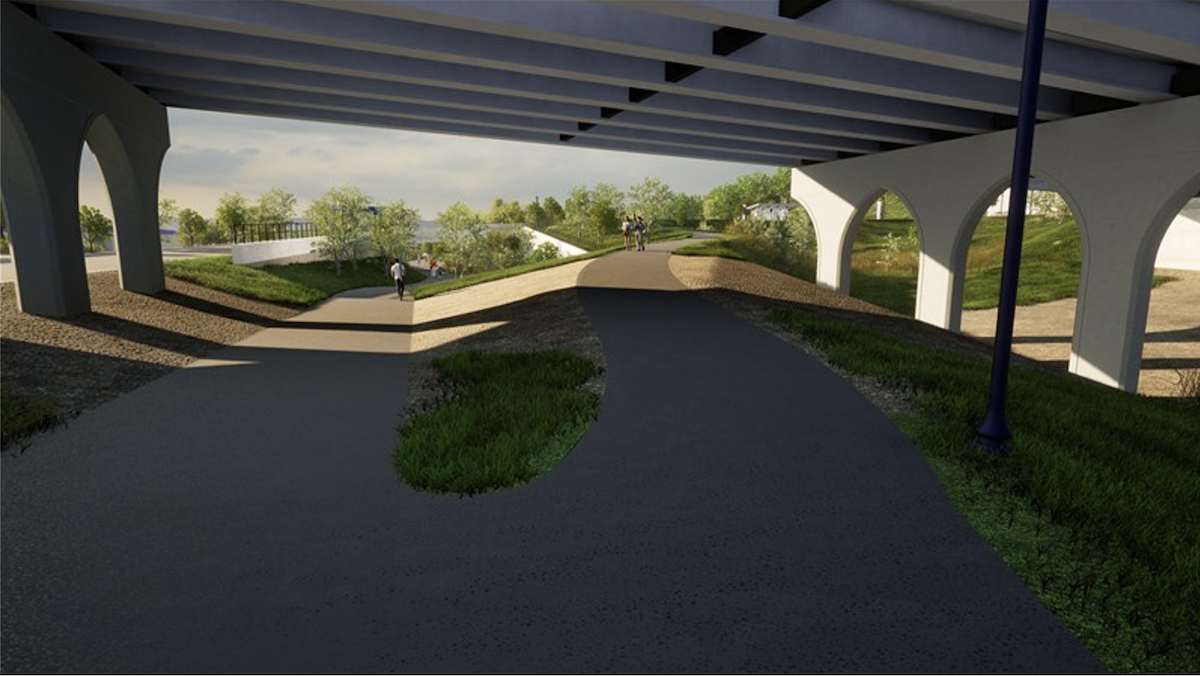 Street-level view from Bruce Vento Regional Trail under the Arcade Street bridge, looking west toward the new trail connection to Arcade and Neid.  