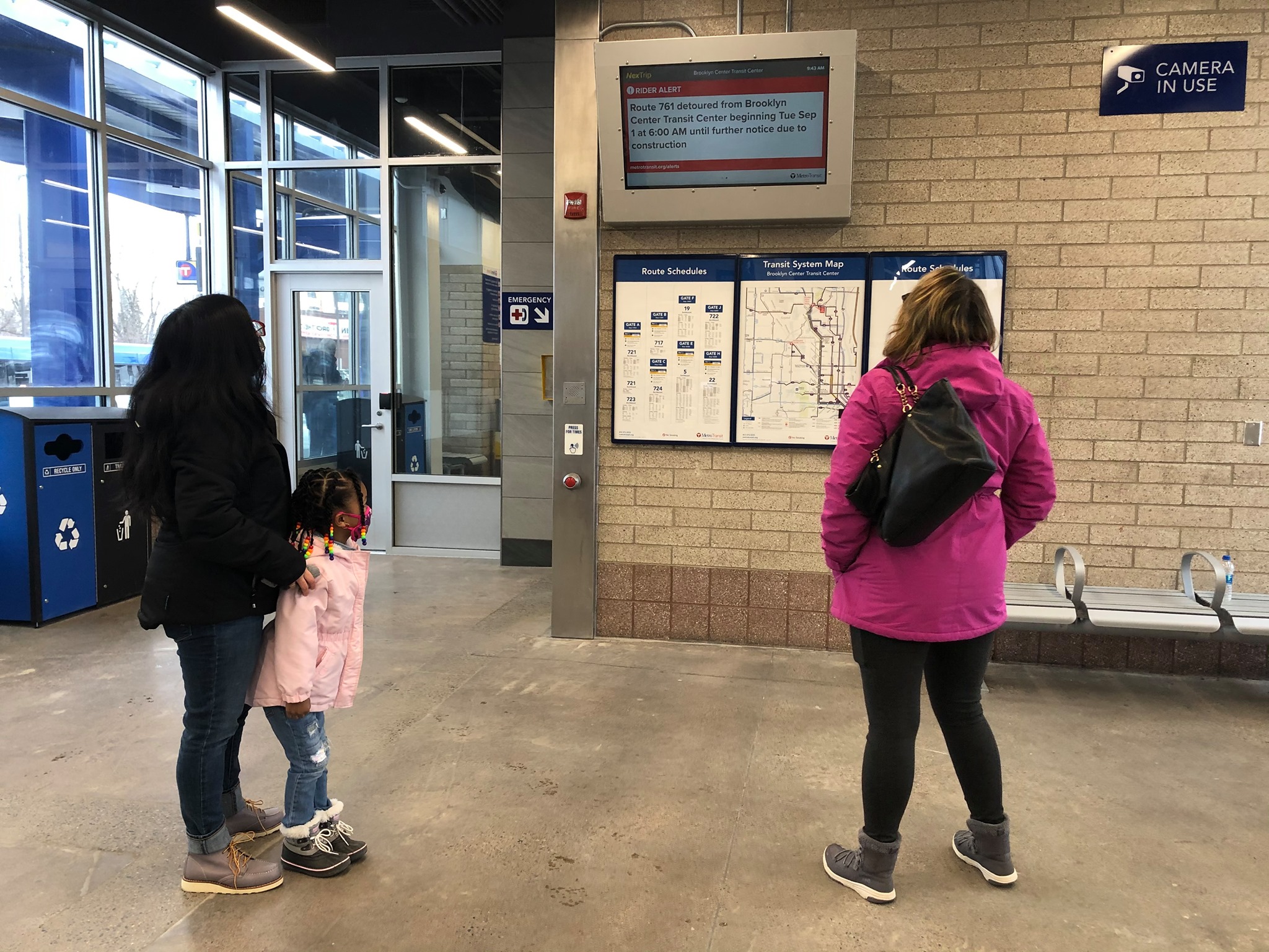 Customers view real-time information at an indoor display at Brooklyn Center Transit Center