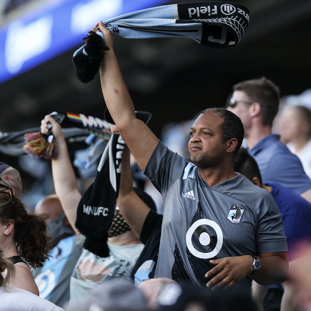 MN United Fan waving a scarf 