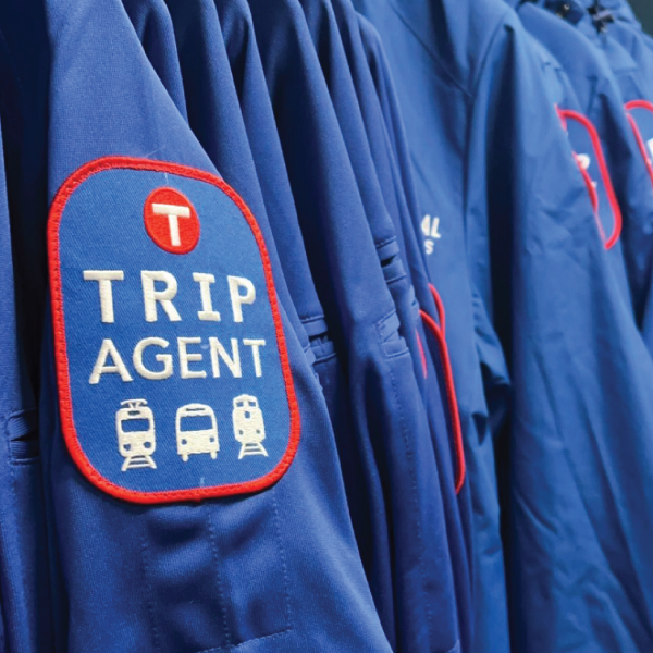 Jackets that display TRIP AGENT patch with bus, light rail, and commuter rail icons