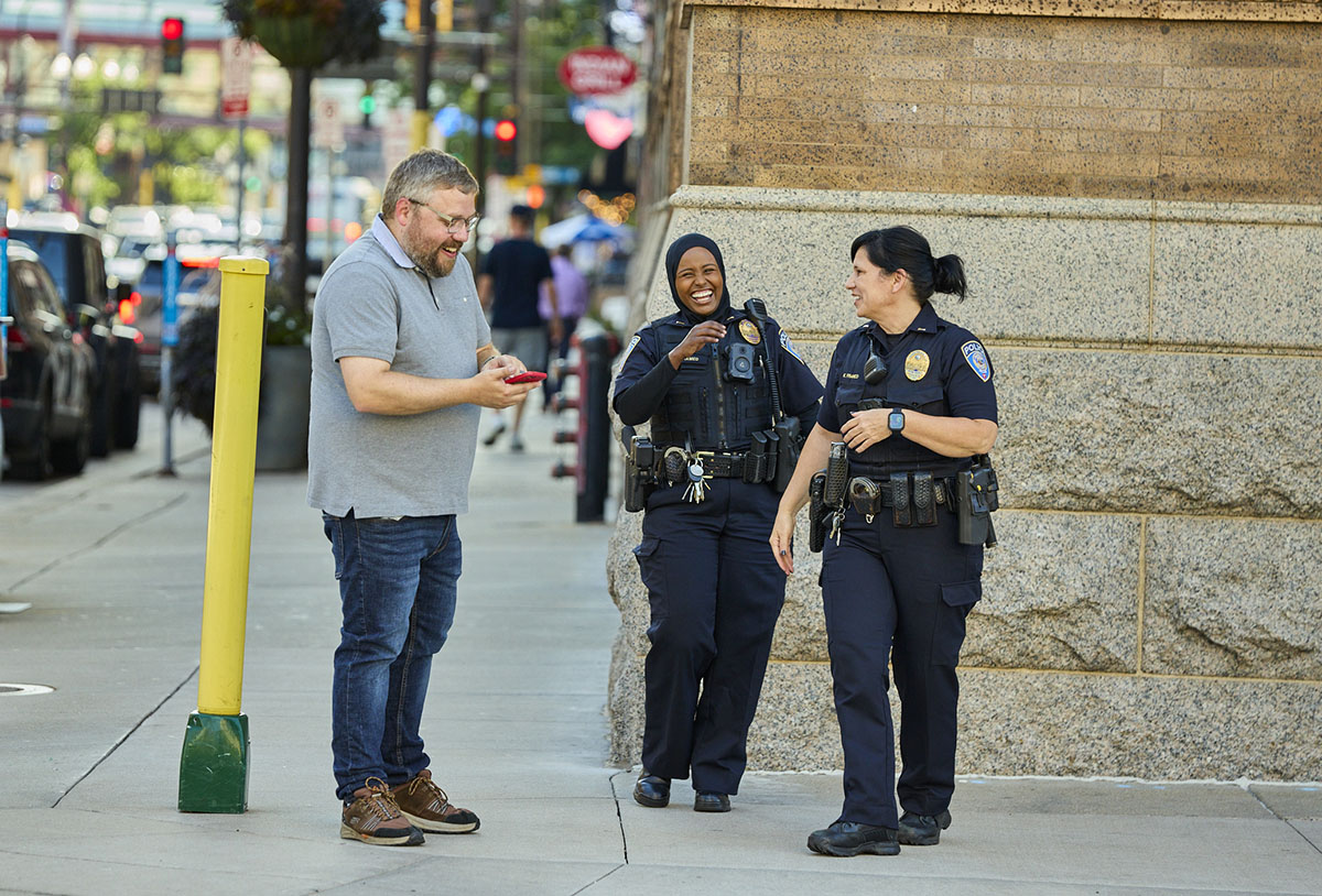 Transit Police officers laughing with a customer