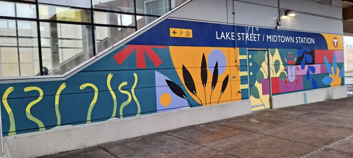 Colorful mural by Hibaaq Ibrahim at Lake Street Station