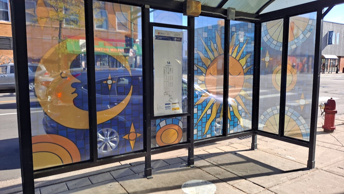 A colorfully decorated bus shelter