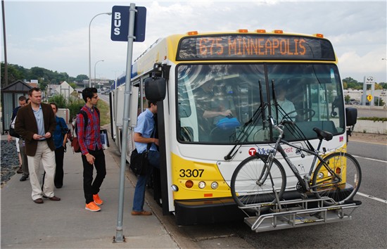 Customers board Route 675 at the Louisiana Transit Center in St. Louis Park. 