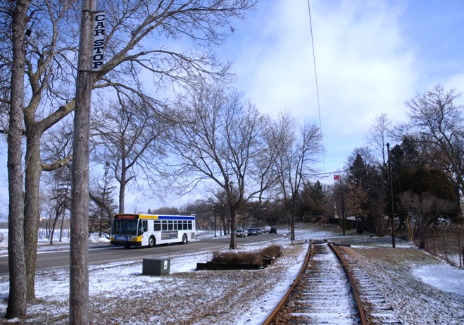 A Route 6 bus passes by streetcar tracks south of Lake Calhoun in Minneapolis.