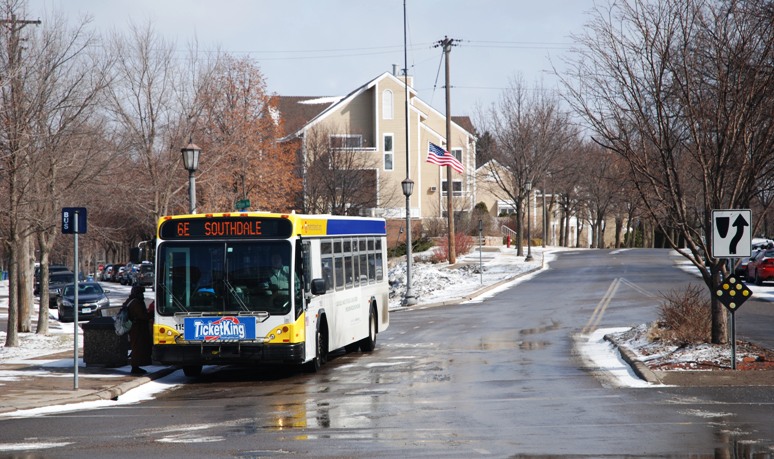 Click to view an image of a customer boarding a Route 6 bus on Xerxes Avenue in Linden Hills on Flickr. A customer boards a Route 6 bus on Xerxes Avenue in Linden Hills.