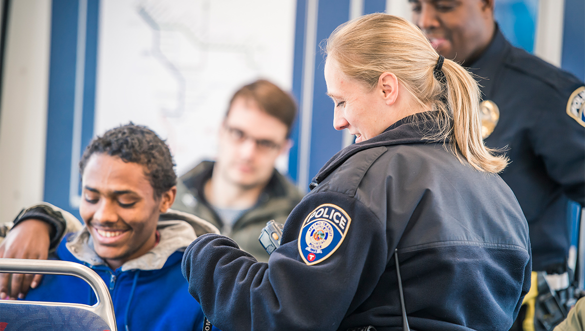 Photo of Metro Transit Police interacting with passengers on the Light Rail