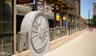 Block of granite carved into the form of a Great Northern locomotive drive wheel.