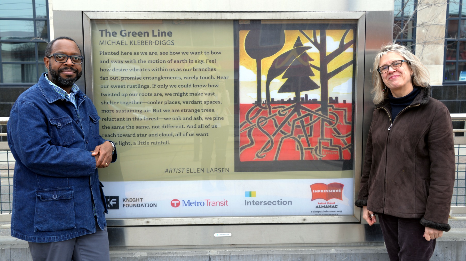 Michael Kleber-Diggs and Ellen Larsen with their poem and artwork at the Green Line's Western Avenue Station.