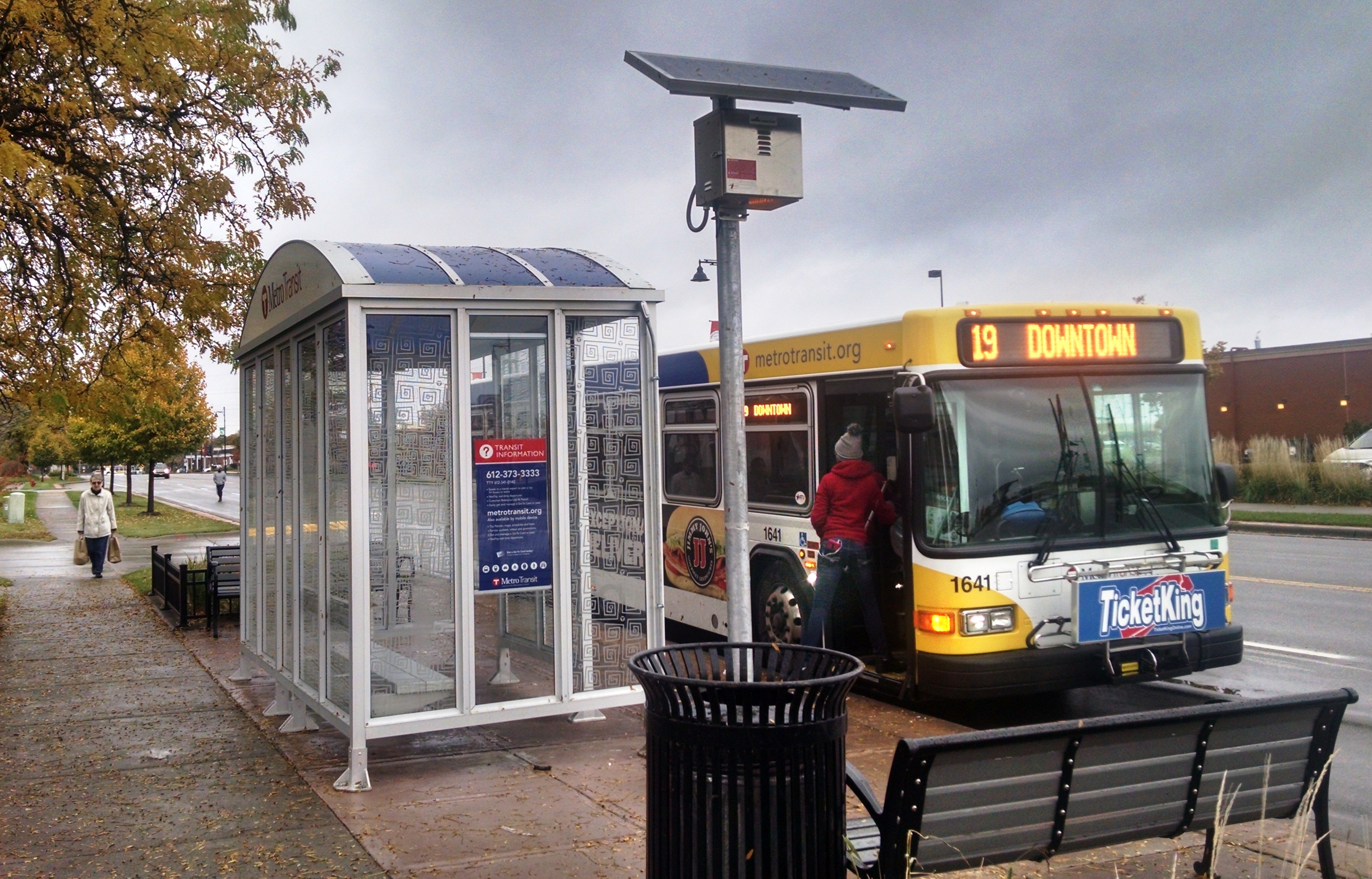 A pole-mounted solar panel is used to provide power for lighting at this Metro Transit bus shelter.