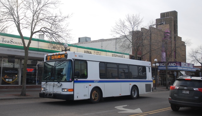 A Route 87 bus travels through St. Paul's Highland Village neighorhood on Cleveland Avenue.